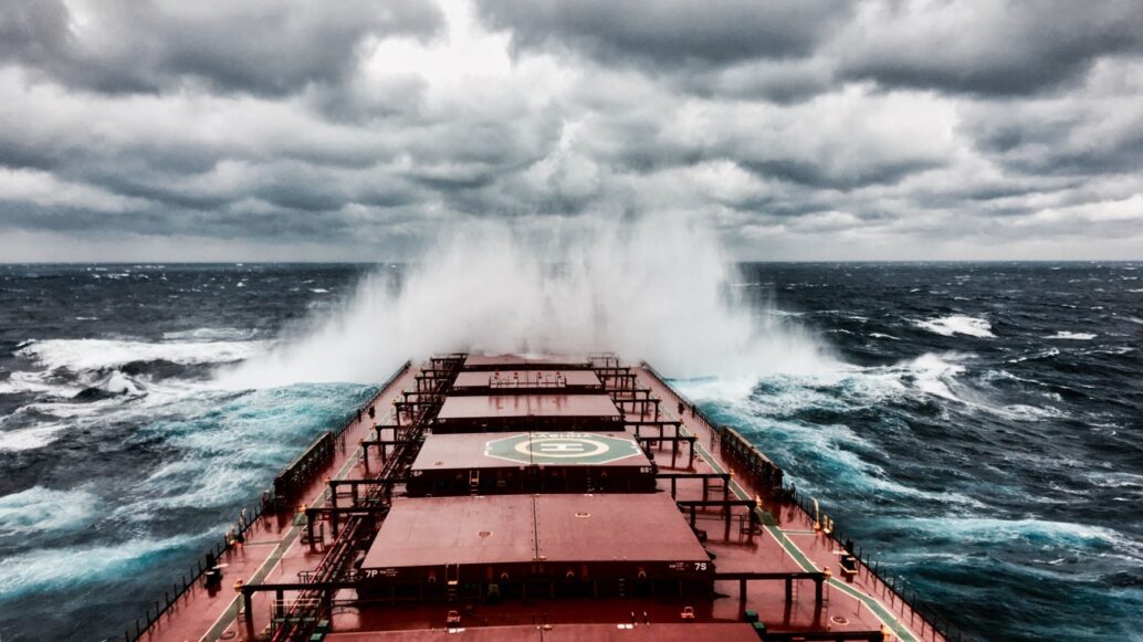 Ship in storm with dark clouds